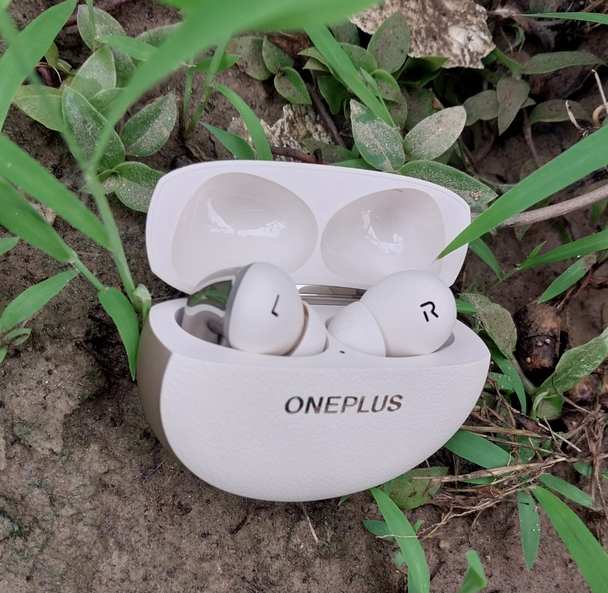 OnePlus Buds Pro earbuds neatly stacked in a different kind of case