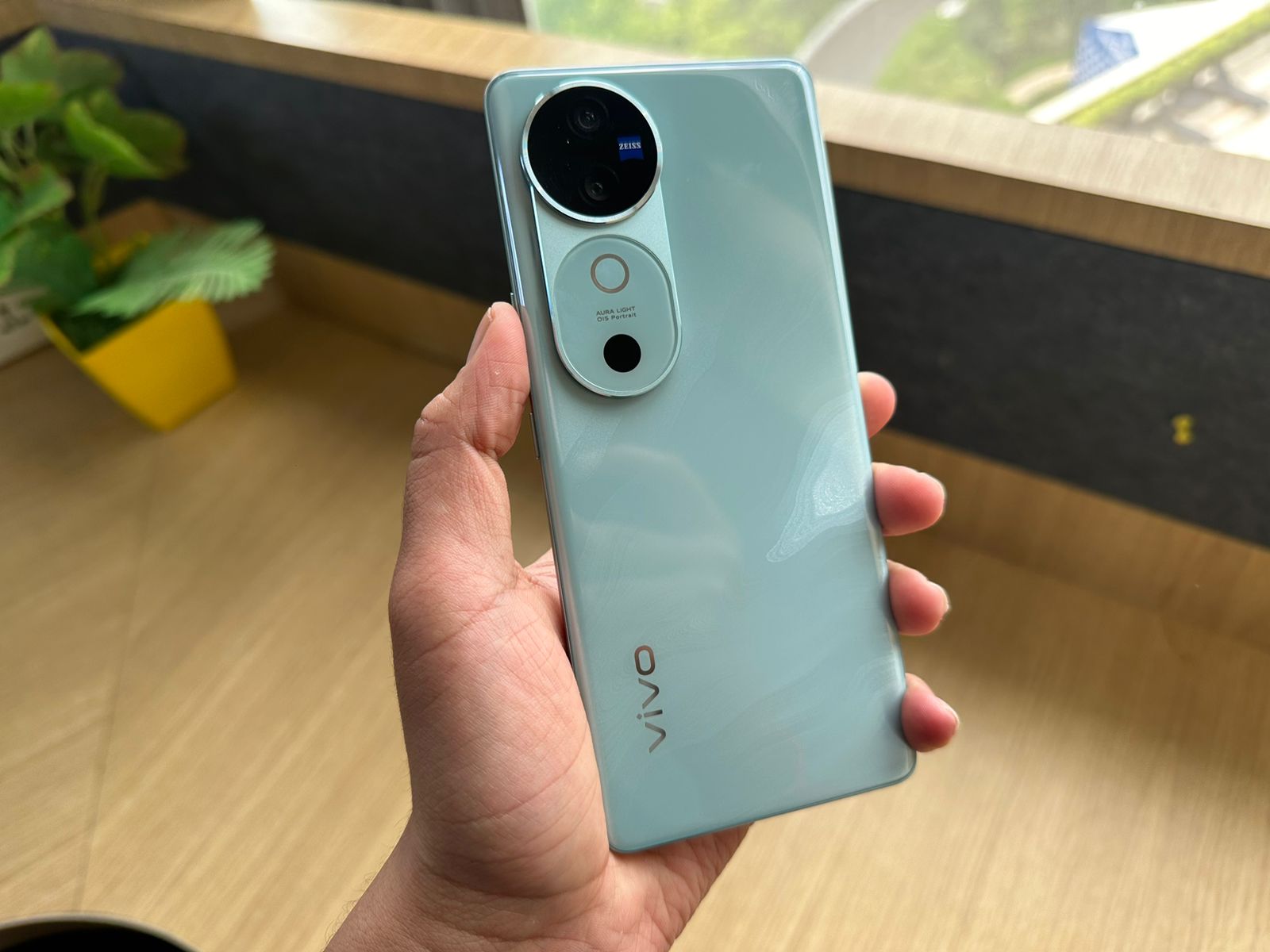 The design includes a metal bezel around the back camera bump